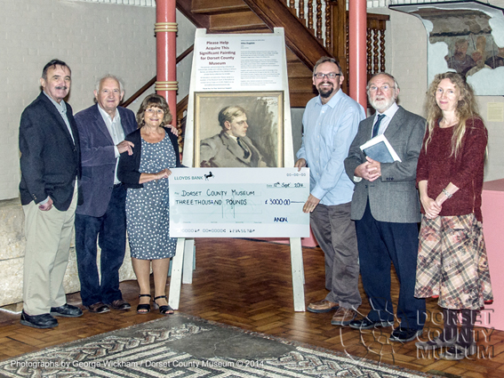 Marion Tait, Honorary Curator of the William Barnes Collection presenting a cheque for Â£3000 to Jon Murden, Director of Dorset County Museum.