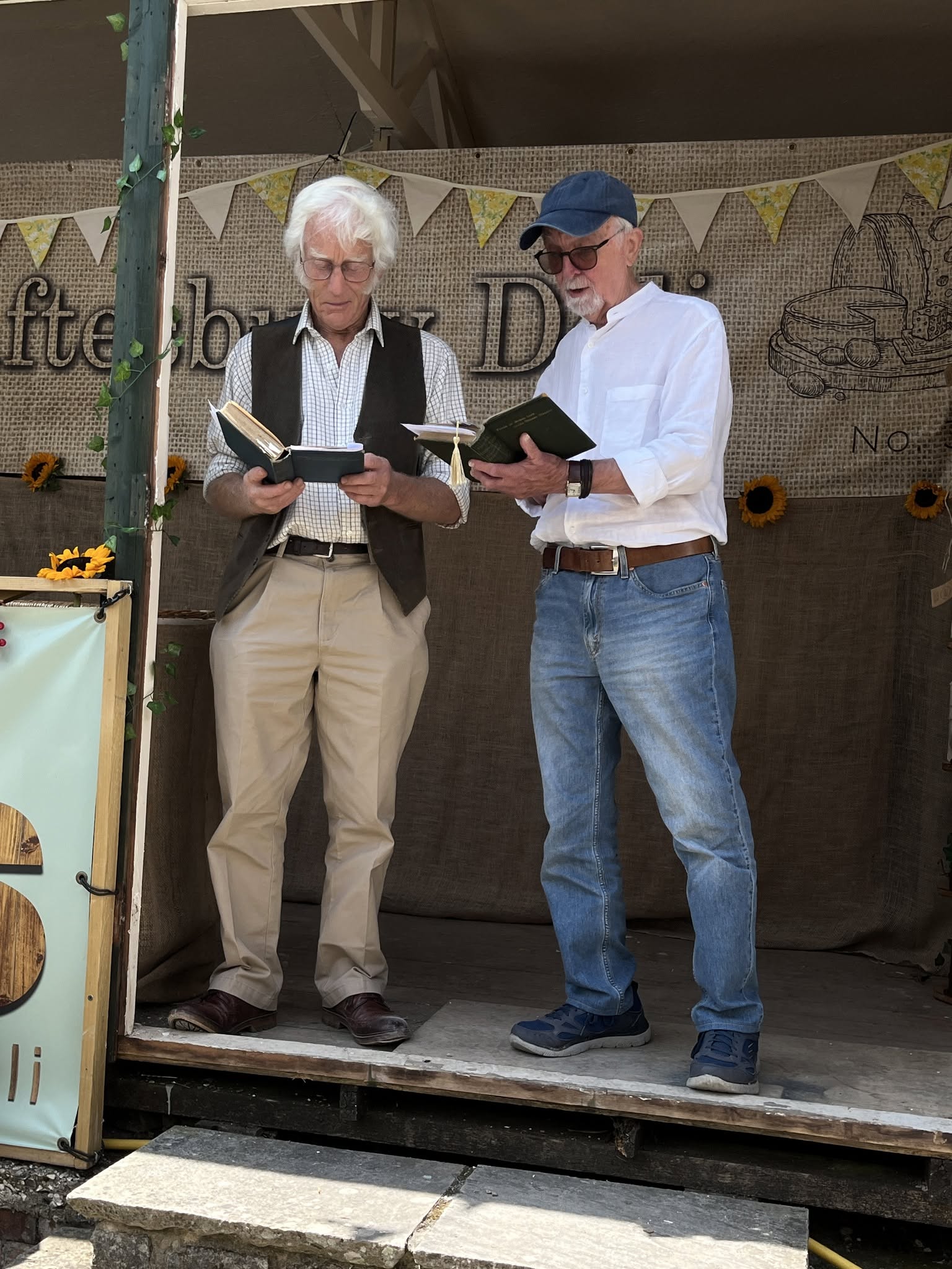 William Barnes Society members Charles Buckler and Brian Caddy reading poetry at the Shaftesbury Deli Garden